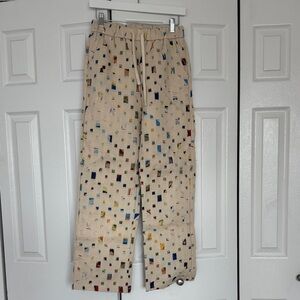 Wide-Leg Printed Drawstring Pants With Colorful Printed Reverse Patches.